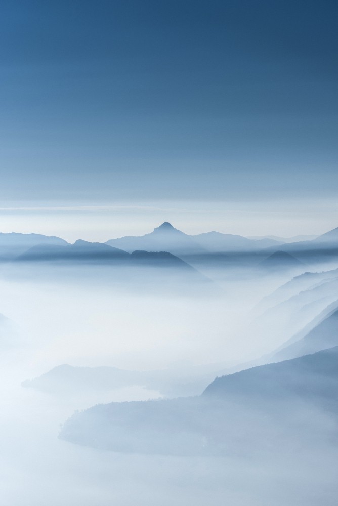 beautiful-shot-of-high-white-hilltops-and-mountains-covered-in-fog